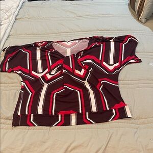 New York and Company colorful, short sleeve blouse with cutaway on shoulder